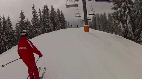 Going down the track past the ski lifts in Bukovel, Ukraine Stock Footage 48597097