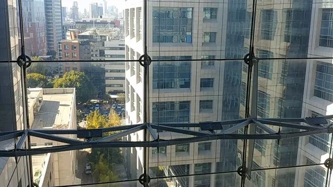 Going down in a transparent elevator in an office building - Tel Aviv Video stock 101147518