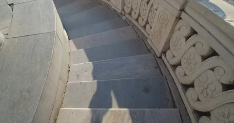 Going down the white stone stairs with bright warm sunlight. Stock Footage 120549607
