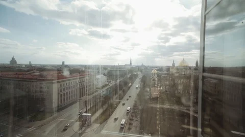 Going up with elevator in city centre next to main and busy street in Stock Footage 126200476