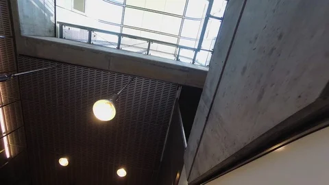 Going up with an escalator in a modern building Stock Footage 110899089