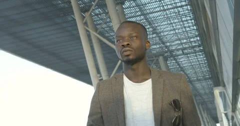 Going forward stylish afro-american man. Serious afro-american businessman is Stock Footage 89583545