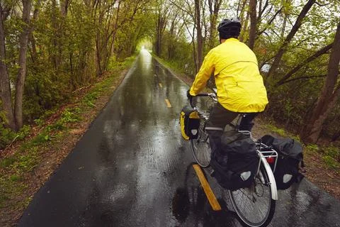 Going, going, gone. Rearview shot of a male cyclist enjoying a bike ride on a Stock Photos