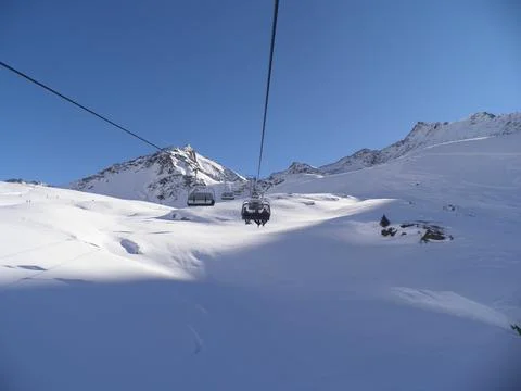Going higher surrounded by fluffy snowy Alps Stock Photos