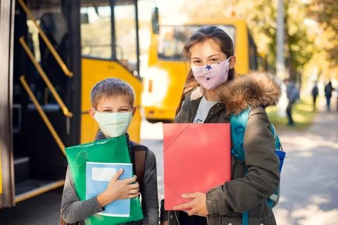 Going home by a school bus during a pandemic Stock Photos