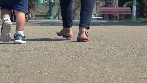 Going home - small kid and parent walking - low shot. 4k 2017 스톡 동영상 82069665