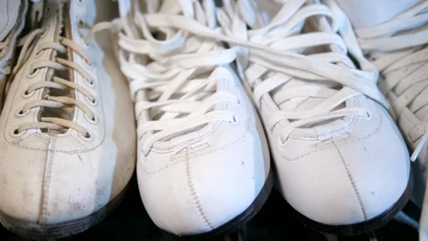 Going Ice Skating. Taking boots. Dolly moving slowly. Isolated. Stock-Footage 123247265