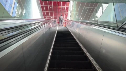 Going Up a Long Escalator from Train Station Stock Footage 168119592
