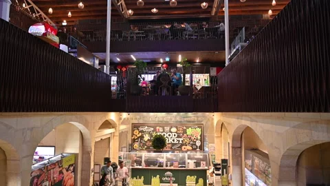 Going to the lower floor with an elevator in a food court market Stock Footage 224866025
