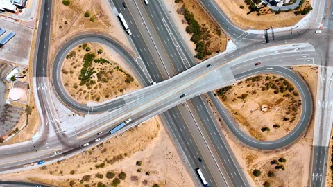 Going over the intersection of multi-lane highways with loops and trestle. Cars Stock Footage 335576259