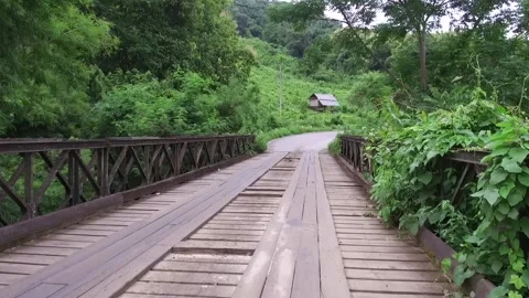 Going over a little bridge North of Luang Prabang, Laos Stock Footage 131922287