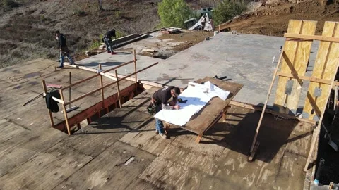 Going over plans at construction yard Stock-Footage 228794786