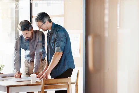 Going over the plans Stock Photos