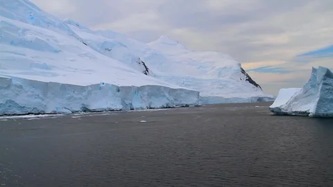 Going past an iceberg mountain and glacier in Antarctica 2 Stock Footage 87340355