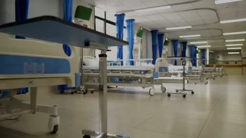 Going Past Row Of Empty Beds In Hospital Ward. Low Angle Dolly Stock Footage 149957343