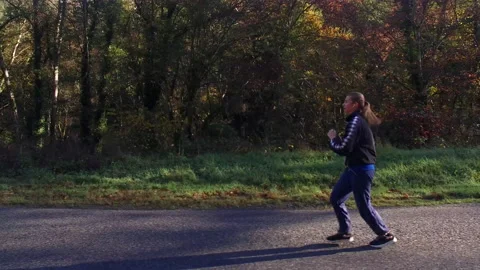 Going for a ride - Female Runner Stock Footage 142887202