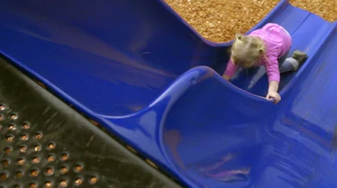Going up a slide the wrong way Stock Footage 56848633