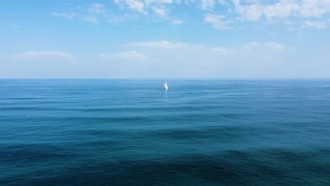 Going slow close to the sail boat deep into ocean Video stock 138559956