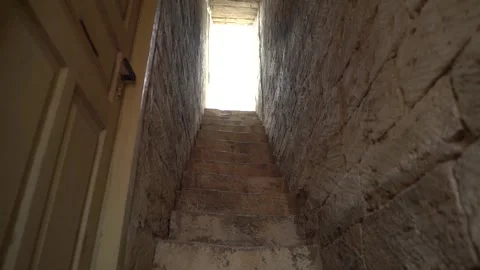 Going up by the stairs in the narrow corridor Stock Footage 252208216