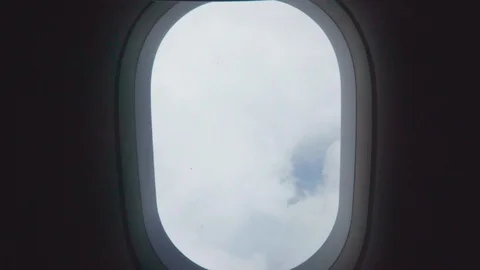 Going through airplane window to clouds. Pov Stock Footage 109504539