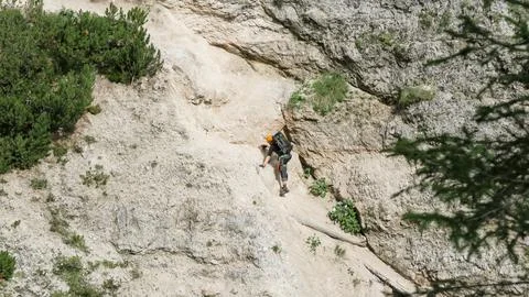 Going through a difficult trail in the full inventory located in the gorge. Stock Photos