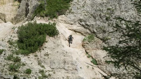 Going through a difficult trail in the full inventory located in the gorge. Stock Photos