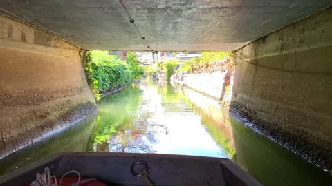 Going through a narrow bridge on a river boat in Yanagawa, Fukuoka, Japan Stock Footage 202151799