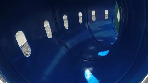 Going through playground tunnel Stock Footage 102239176