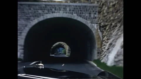 Going through Two Tunnels in the Swiss Alps 1957 Stock Footage 48077538