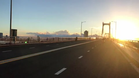 Going up Thuan Phuoc bridge of Da Nang city in beautiful sunset Stock Footage 143990103