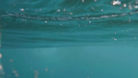 Going under a breaking wave / Super clear shot underwater Stock Footage