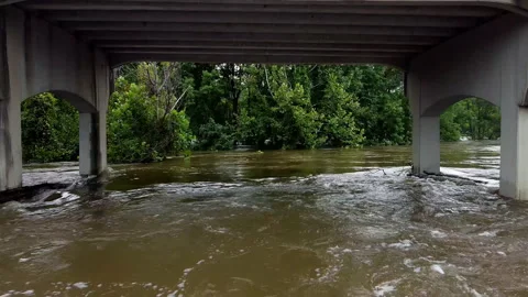 Going under flooded bridge in the Pearl River, Jackson MS Stock Footage 205899308