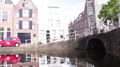 Going under old bridge over canal of Delft Stock Footage 142479229