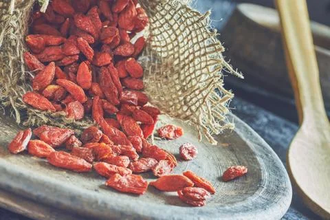 Goji berries on rustic background Stock Photos