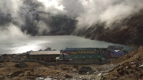 Gokyo- a static shot of a town, clouds moving through it Stock Footage 104342706