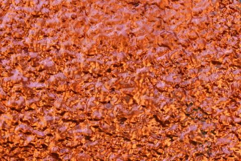 Gold and orange sprayed wall texture Stock Photos
