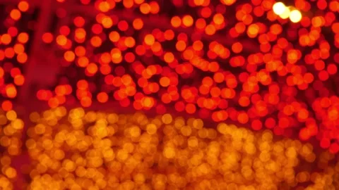 Gold and red blurred lighting illumination rotates in holiday night Stock Footage 165243327