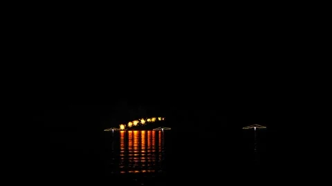 Gold and red fireworks flashes from ships on the black night sky against th.. Stock Footage 250277555