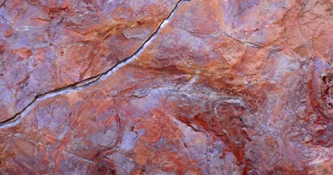 Gold and rust rock color closeup of texture detail pull-back movement. Stock Footage 314068317