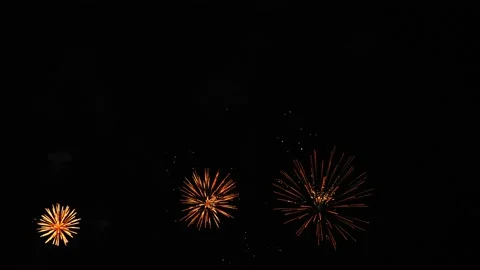 Gold and silver bright flashes of fireworks on the night black sky Video stock 198045138