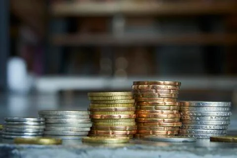 Gold and silver coin stack on blur background. Stock Photos