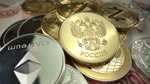 Gold and silver Cryptocoins with russian golden coin lie on russian money Stock Footage 132321335