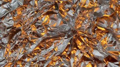 Gold and Silver Tecture Background Rumpled Foil with Soft Light Stock Photos