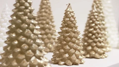 Gold and white glitter trees arranged studio still life sparkling texture modern Stock Footage 321816136