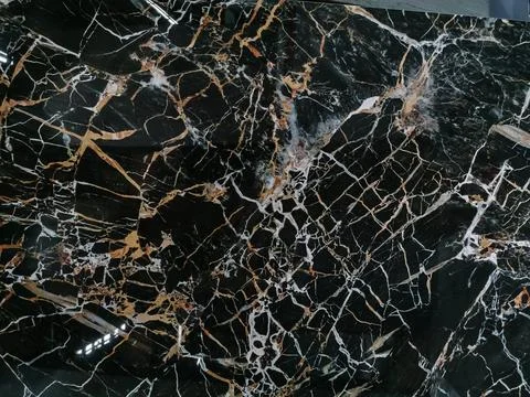 Gold and white Patterned natural of dark gray marble (Gold Russia) texture .. Stock Photos