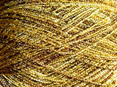 Gold background from a skein of thread. template for design Stock Photos