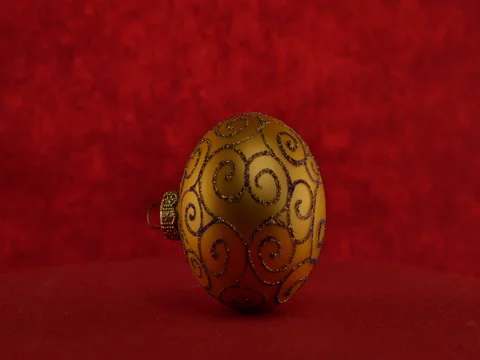 Gold ball on red background Stock Footage 70487280