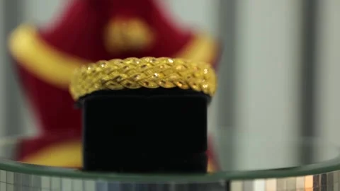 Gold Bangle with Ornamental Pendant Stock Footage 339707484