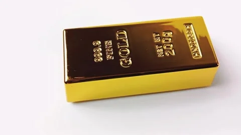 Gold bar rotating on a white background Stock Footage 329080995