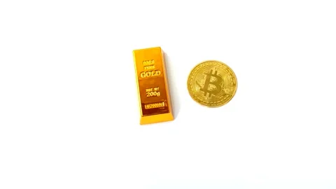 Gold bars and Bitcoin (BTC) on an isolated white background 스톡 동영상 325015649